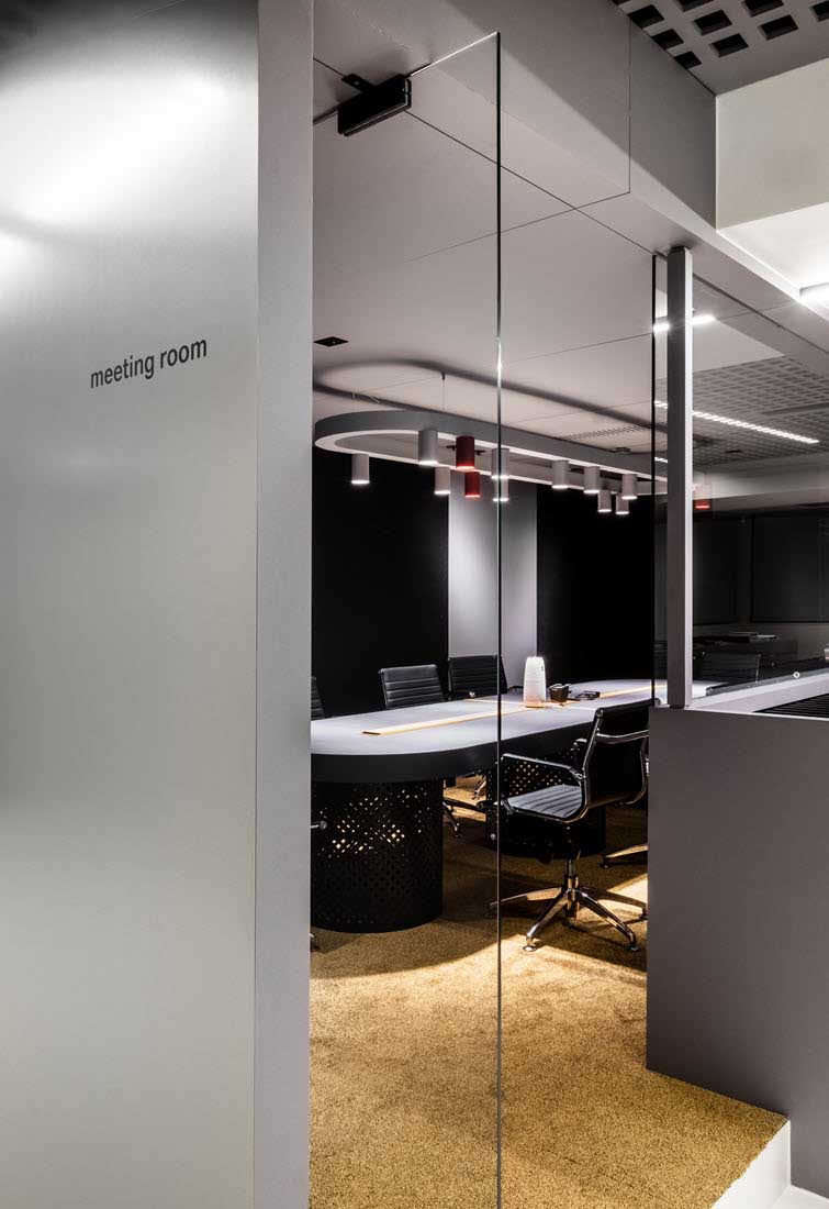Meeting rooms finished entirely in grey decorative MDF panels by Unilin Panels.